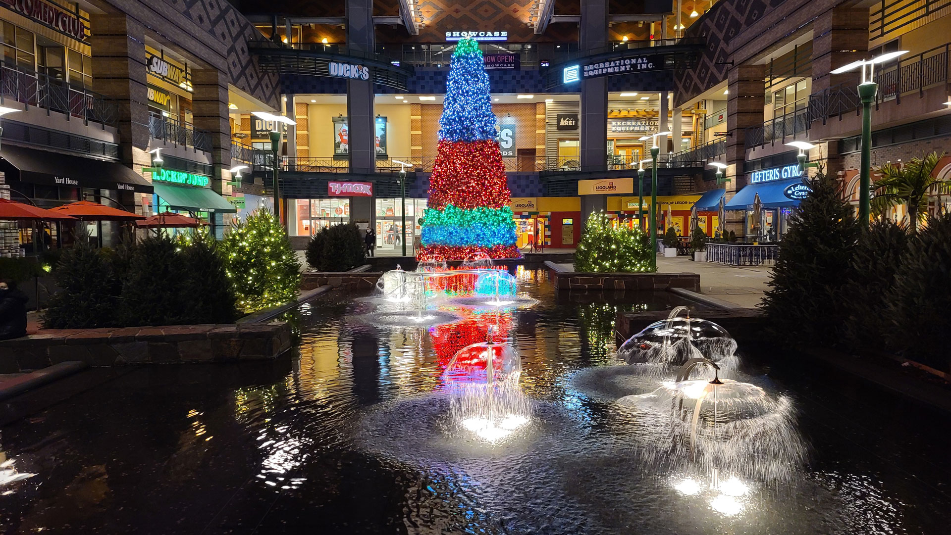 A dazzling holiday lights and decor display in a mall created by the designers at Land of ELITE