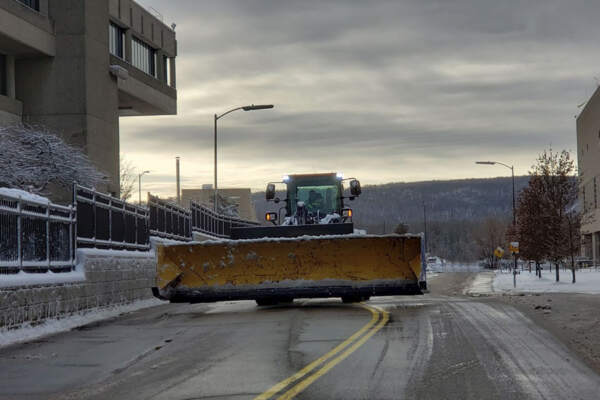 Powerful bulldozer equipped for efficient snow removal services, clearing pathways by Land of ELITE in New York