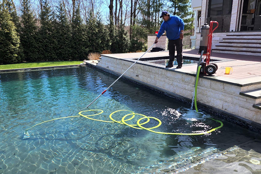 Professional pool maintenance service, ensuring a clean and well-maintained pool for a luxurious outdoor living experience